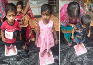Every mother checks her child's weight before the the monthly camps of the Saksham Project beings.