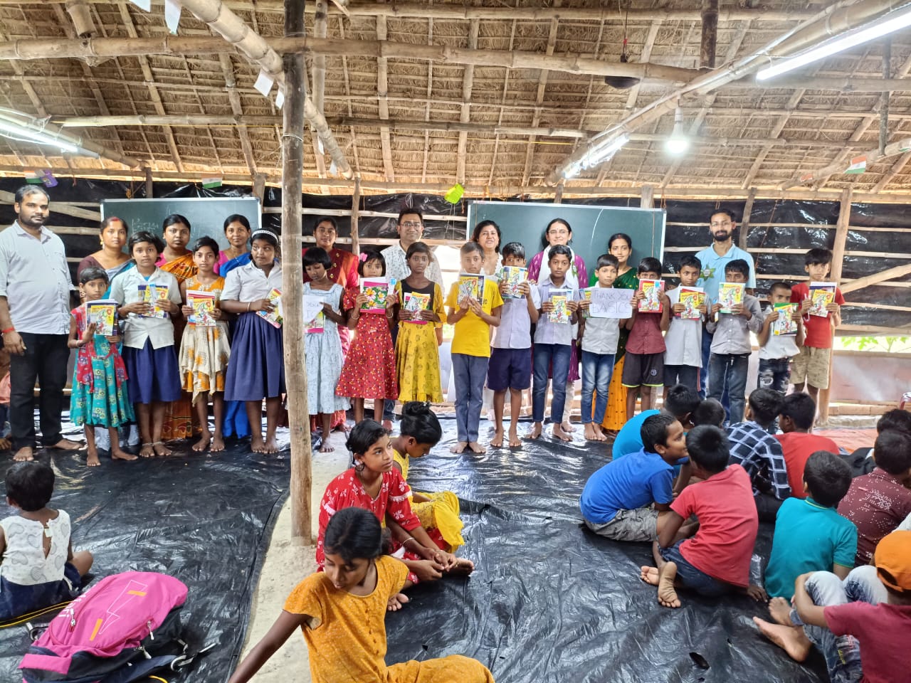 Books are being distributed to the students of the Barnaparichay Education Centre, Sonagoan run by SAI for the new academic year 2025.
