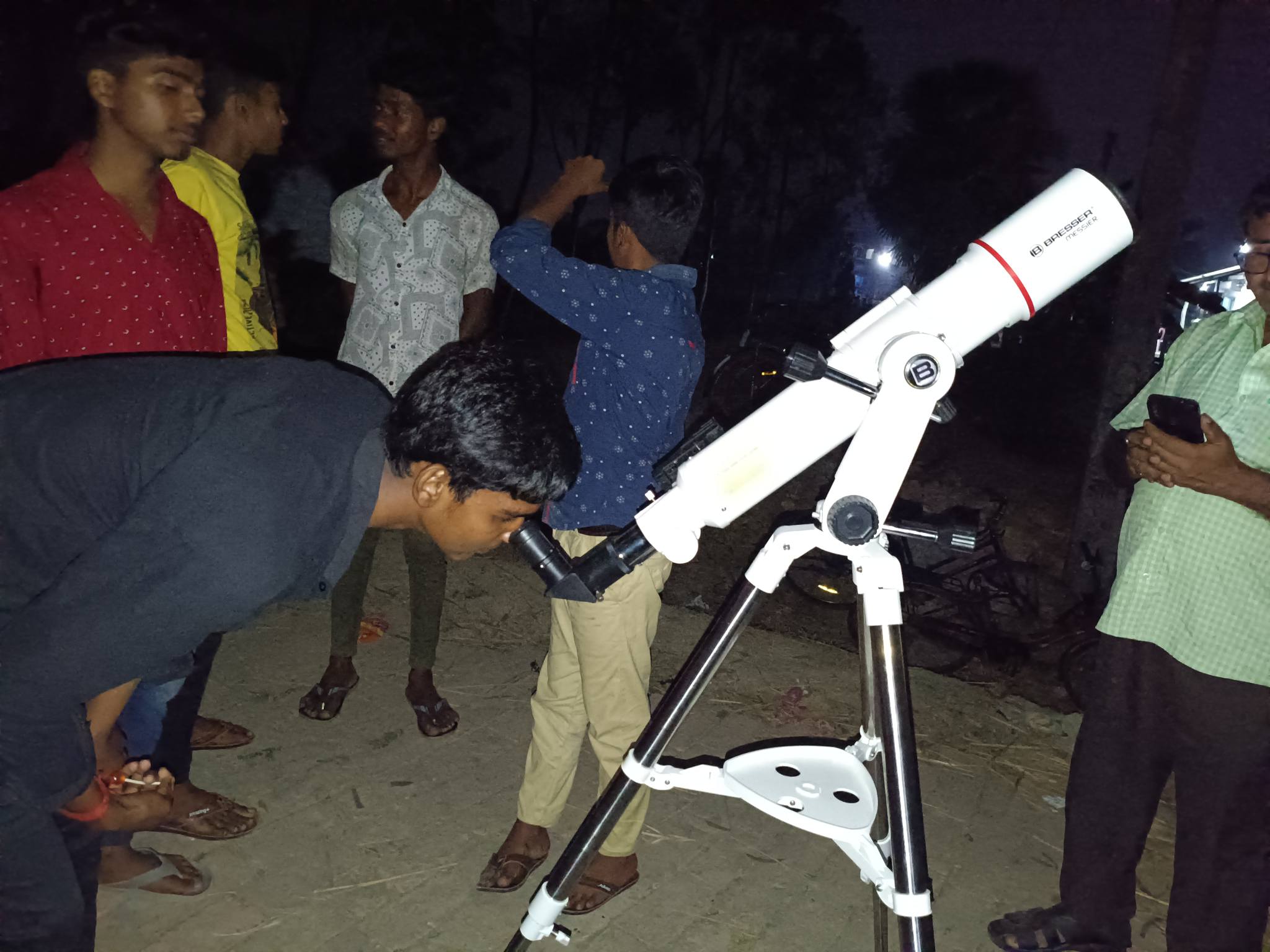 Excited children are observing the moon, stars in the night in various ways using telescope.