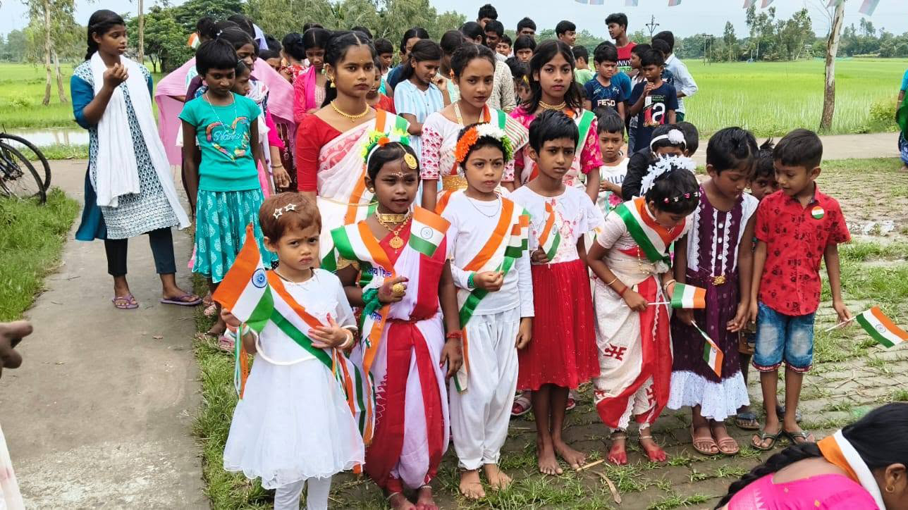 Students of Barnaparichay Education Centre moments before the Indian National Flag-hosting on Indian Independence Day.